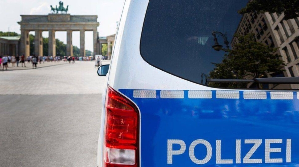 Police car in front of the Brandenburg Gate.