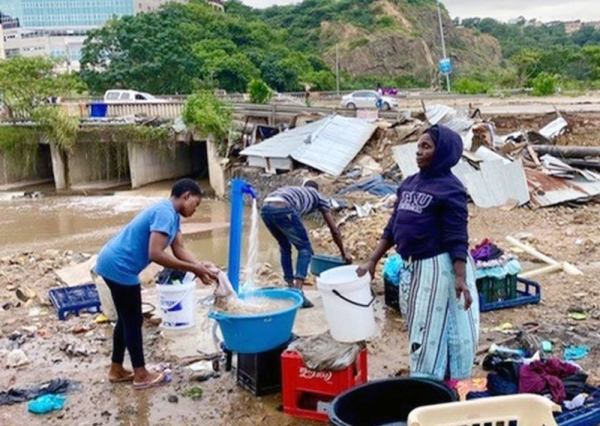 People getting water — courtesy BBC/Camilla Mills