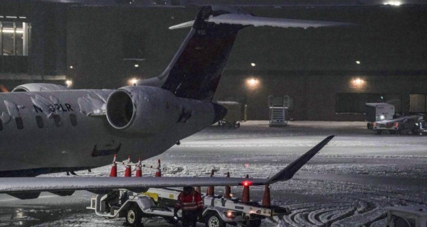 A plane on a tarmac in Albany, New York, where residents saw 'thundersnow' storms.