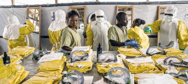 Health workers put on personal protective equipment (PPE) before entering an Ebola quarantine zone in the Democratic Republic of the Congo. — courtesy (file) World Bank/Vincent Tremeau
