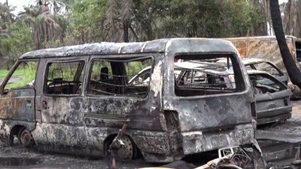 A picture from the scene of the explosion shows burned-out vehicles.