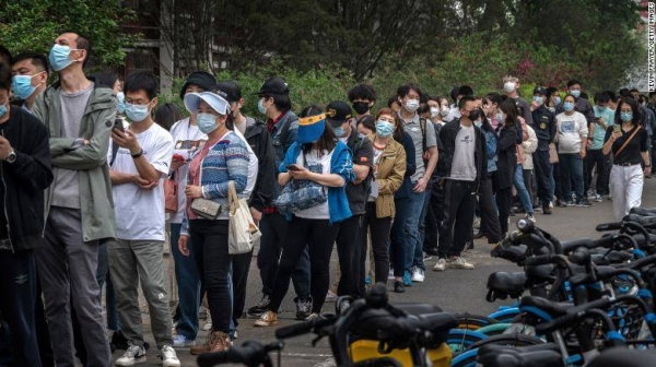 People line up for Covid tests at a makeshift testing site in Beijing's Chaoyang district on Monday.