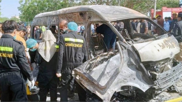 Pakistani security officials inspect the scene of an explosion in Karachi, Pakistan, on Tuesday.