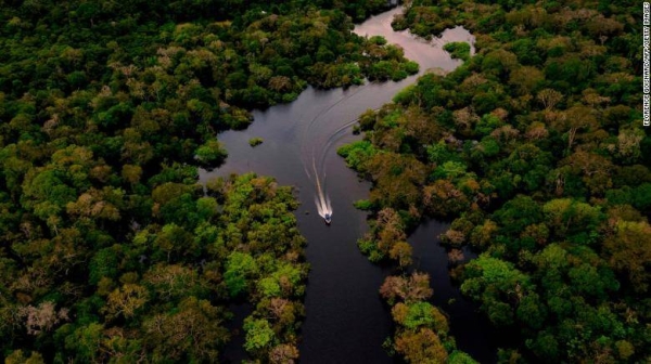 A boat speeding on the Jurura river in the heart of the Brazilian Amazon Forest on March 15, 2020. The greatest tropical forest lost last year was in Brazil.