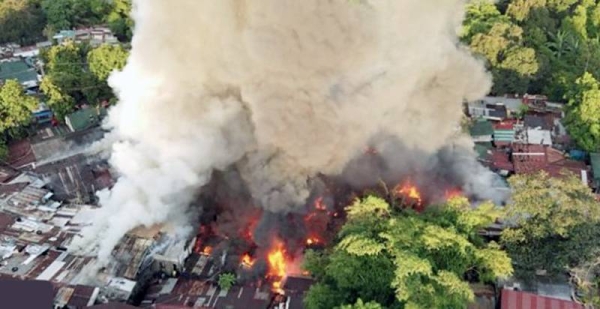 Screenshot of a fire that tore through scores of homes near the Philippines capital Manila, on Monday.