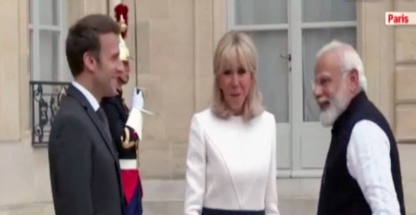 French President Emmanuel Macron and his wife Brigitte Macron welcome Indian Prime Minister Narendra Modi at the Élysée Palace on Wednesday.

