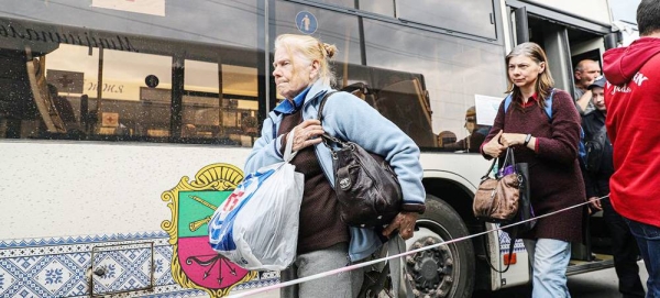 Civilians from Mariupol flee the Azovstal steel plant in Mariupol in a UN-led evacuation. Journalists in the city were reportedly targeted there. — courtesy UNOCHA/Kateryna Klochko