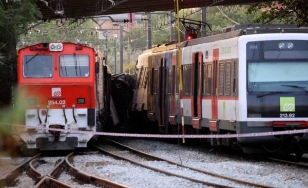 The collision happened when a freight train derailed and crashed into a passenger train at the station in Sant Boi de Llobregat, around 14 km (8.7 miles) from Barcelona, at around 6 p.m.