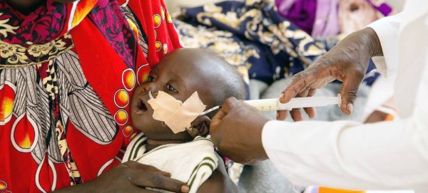 A 6-month-old, malnourished boy in South Sudan receives milk through a feeding tube. — courtesy UNICEF/Bullen Chol