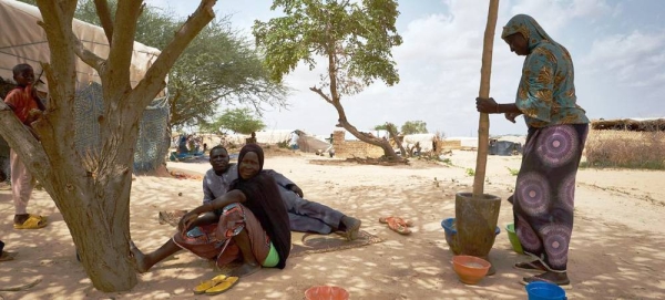 A displaced family sit in front of their tent at an informal camp in Bagoundié in Mali. — courtesy UNOCHA/Michele Cattani