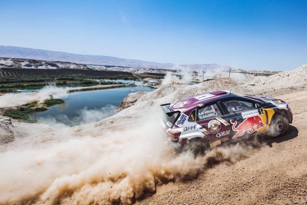 Nasser Saleh Al-Attiyah by the Jordan River at the lowest place on earth. 