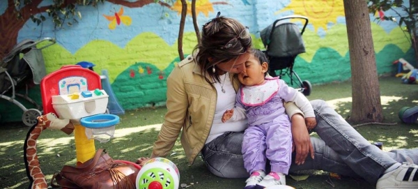 Mother kisses her daughter at the Catalina Home in Santiago, Chile. — courtesy UNICEF/UNI136081/Friedman-Rudovsky