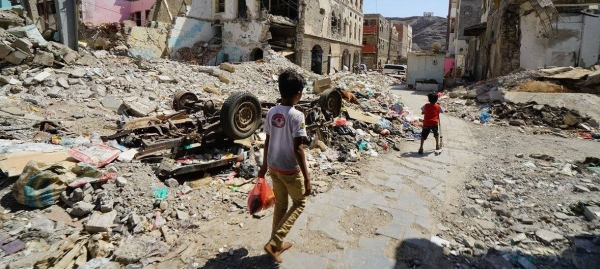 Children walk through a damaged part of downtown Aden, Yemen. The area was badly damaged by airstrikes in 2015 as the Houthi’s were driven out of the city by coalition forces.