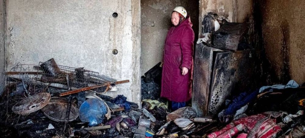 A residential building burns after being shelled in Kiev, Ukraine. Two people died and fifty people were rescued by Ukraine emergency workers. — courtesy  UNDP Ukraine/Pavlo Petrov