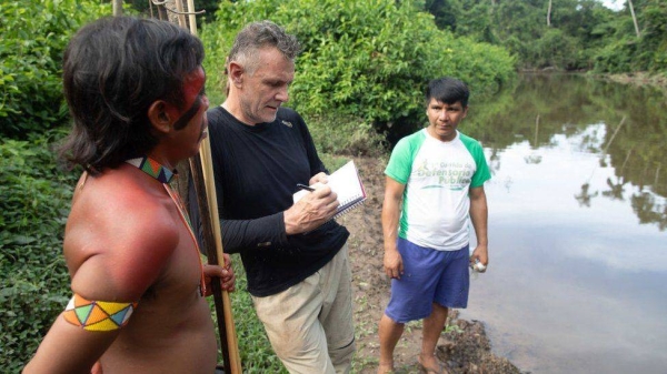 Dom Phillips talking to two indigenous men in Roraima State, Brazil in 2019l
