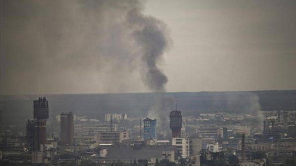 Black smoke and dirt rise from the nearby city of Severodonetsk during battle between Russian and Ukrainian troops in the eastern Ukraine region of Donbas on June 9, 2022.