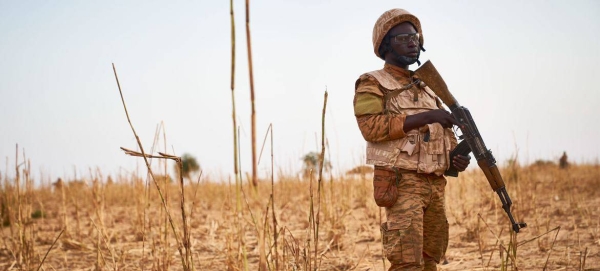 A soldier from Burkina Faso stands guard along the border with Mali and Niger during a military operation against terrorist suspects.