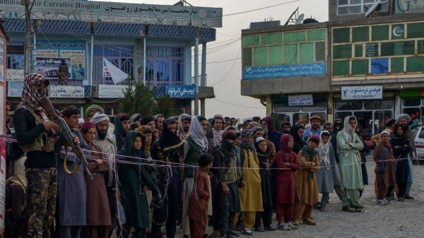 People in the city of Sharan, capital of Paktika province, queue to give blood to earthquake victims being treated in hospital.