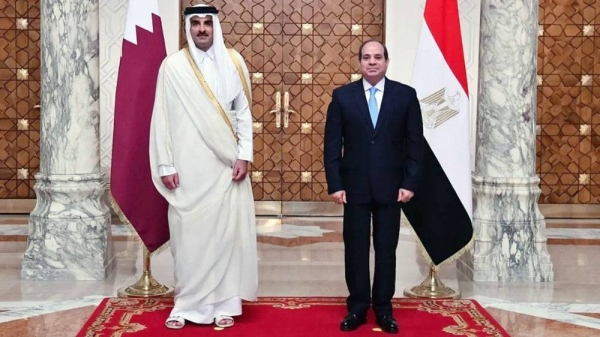 A handout picture released by the Egyptian Presidency shows President Abdel Fattah El-Sisi (R) receiving the Emir of Qatar Sheikh Tamim Bin Hamad Al Thani at the presidential palace in Cairo, on Saturday.