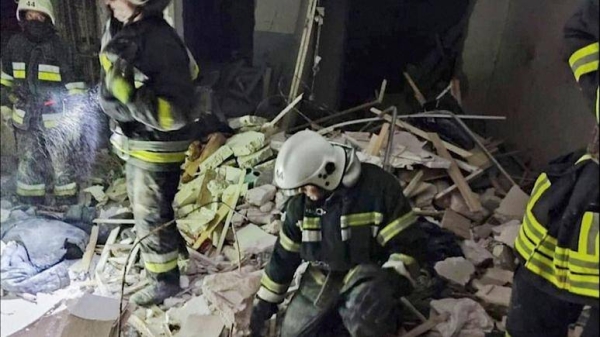 First responders work a damaged residential building in Odesa, Ukraine, early Friday, July 1, 2022, following Russian missile attacks.