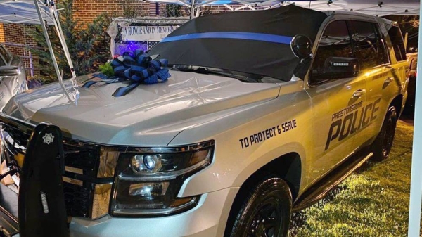 Wreaths were placed on police cars as a tribute