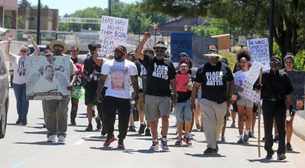 Protesters march along South High Street on Saturday in Akron, Ohio, calling for justice for Jayland Walker after he was fatally shot by police. .jph