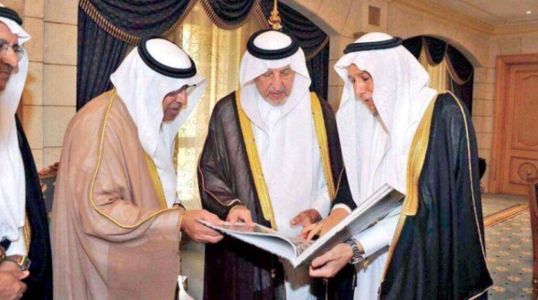 Makkah Emir Prince Khalid Al-Faisal, advisor to Custodian of the Two Holy Mosque, while reviewing the book. (Picture: Asharq Al-Awsat)