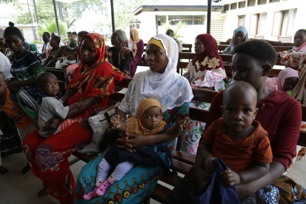 Children wait to be vaccinated against polio in Tanzania. (Xinhua)