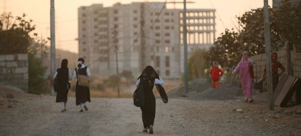 Kurdish girls return home from school in the city of Dohuk in the northern Kurdistan Region, Iraq.