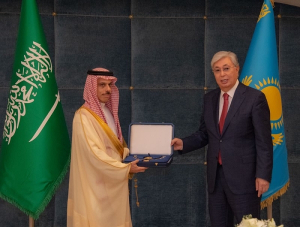 Foreign Minister Prince Faisal Bin Farhan receives the Order on behalf of Custodian of the Two Holy Mosques.