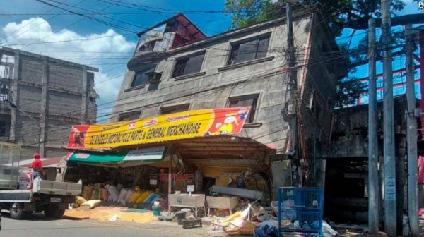 A damaged building lies on its side after an earthquake in the Philippines' Abra province.
