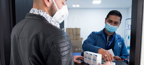 A man receives his HIV medication during the COVID-19 pandemic in Colombia.