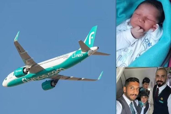 The baby and the flynas crew members 