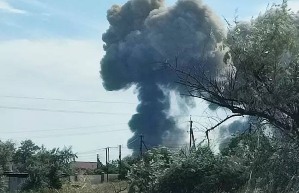 Smoke rises after explosions were heard from the direction of a Russian military airbase near Novofedorivka, Crimea .