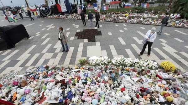 Mourners leave flowers where people were killed along the Promenade des Anglais in Nice in 2016. — courtesy photo