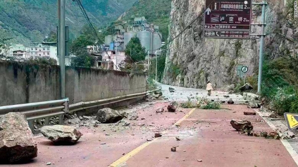 In this photo provided by China's Xinhua News Agency, fallen rocks are seen on a road near Lengqi Town in Luding County of southwest China's Sichuan Province on Monday, September 5, 2022.
