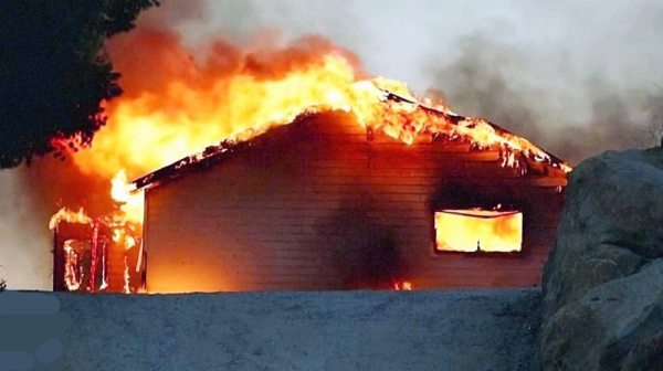 Two people were killed as a fast-moving wildfire swelled rapidly over parched vegetation in Southern California, forcing hundreds of residents to flee amid a severe heat wave that has enveloped the region.