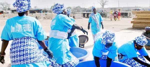 A women's collective processes sardinella in Senegal. — courtesy UN Women/Bruno Demeocq