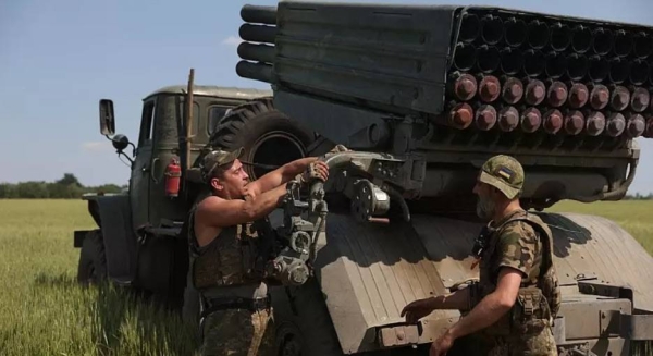 Ukrainian artillerymen prepare to fire a BM-21 Grad multiple rocket launcher near Izyum, south of Kharkiv, in this file picture.