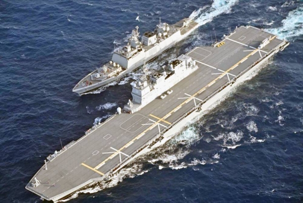 

The Japanese Maritime Self-Defense Force's Izumo helicopter carrier refuels an Indian Navy frigate (back) in the Bay of Bengal on Sunday. — courtesy of Japanese Maritime Self-Defense Force - Kyodo