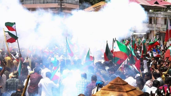 Police use tear gas to disperse members and activists of the Popular Front of India (PFI) during a demonstration to protest against what they say is police targeting its leaders.