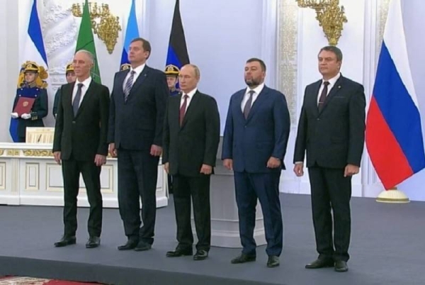 President Putin attending the signing ceremony in the Kremlin.