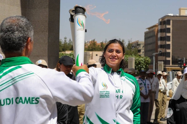Saudi Olympian Judoka Tahani Alqahtan participates in Saudi Games 2022 torch relay at Taif. (@SaudiGames2022)