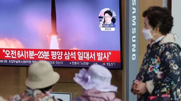 People watch a TV report in Seoul, South Korea on North Korea's firing of two short-range ballistic missiles into the East Sea.