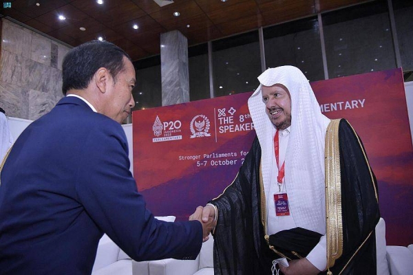 Indonesian President Joko Widodo receiving Saudi Shoura Council President Sheikh Abdullah Al-Sheikh during the inaugural session of the 8th G20 Parliamentary Speakers’ Summit, which began in Jakarta on Thursday. 