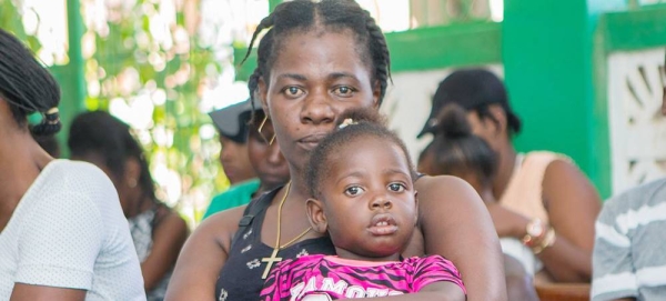 Mothers wait with their children to be vaccinated at a UNFPA-supported hospital in southern Haiti. — courtesy UNFPA/Ralph Tedy Erol
