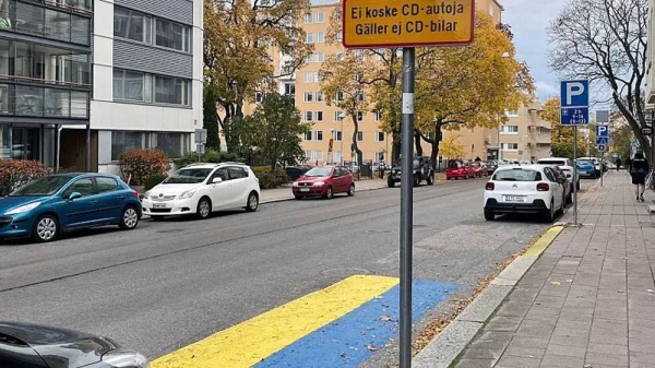 The colors of Ukraine’s flag painted in the parking space outside home of Russian Consul General, Turku, Finland. — courtesy Ellen Into