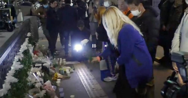 People pay tribute to victims near the scene of a deadly accident in Seoul, South Korea, Sunday, after Saturday’s Halloween festivities. — courtesy photo