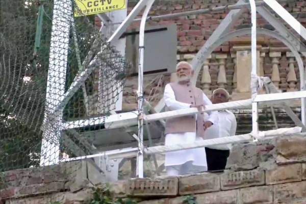 Indian Prime Minister Narendra Modi, along with Gujarat Chief Minister Bhupendra Patel, visits the incident site in Morbi, Gujarat, while the search and rescue operation is under way in the Macchu River. — courtesy Twitter