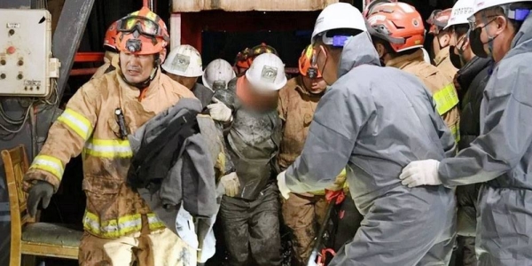 Two miners are pulled to safety after the collapse of a mine in South Korea. — courtesy photo News1
